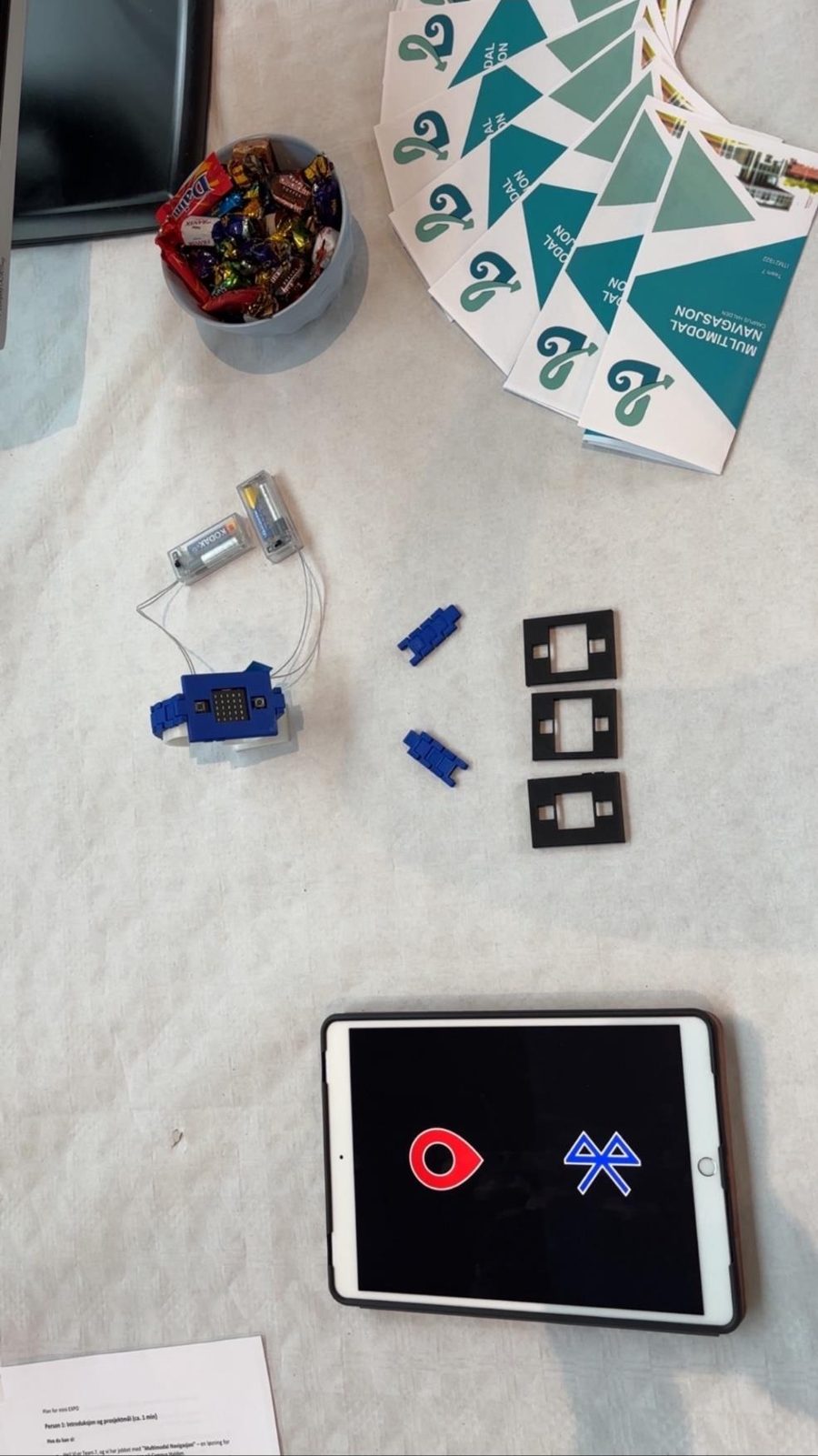 The table with the prototype, brochures and a tablet