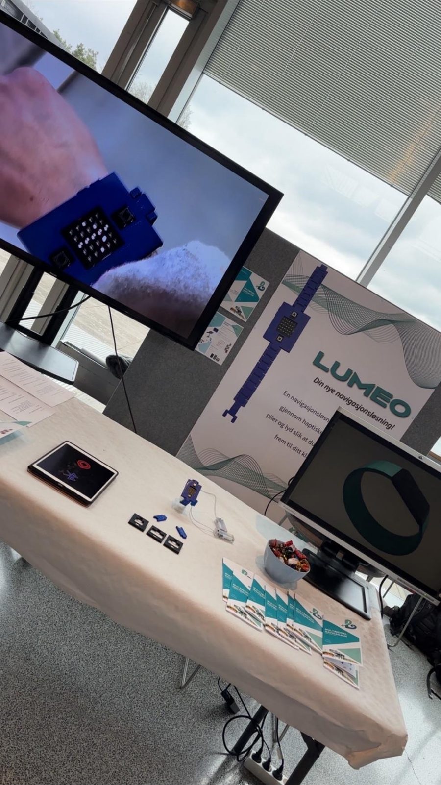 The stand with a screen, poster and prototype